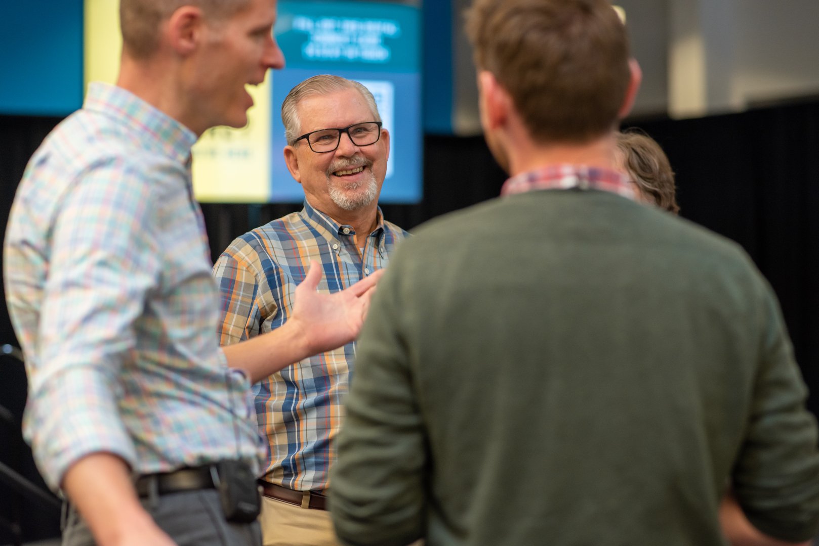 men talking at church