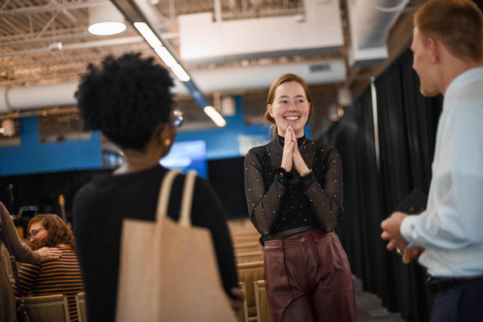 young woman smiling at church